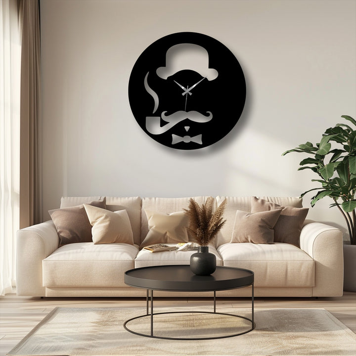 The distinct edge and borders of the round black vintage gentleman unique metal wall art clock with a polished silver silhouette and subtle shadow.
