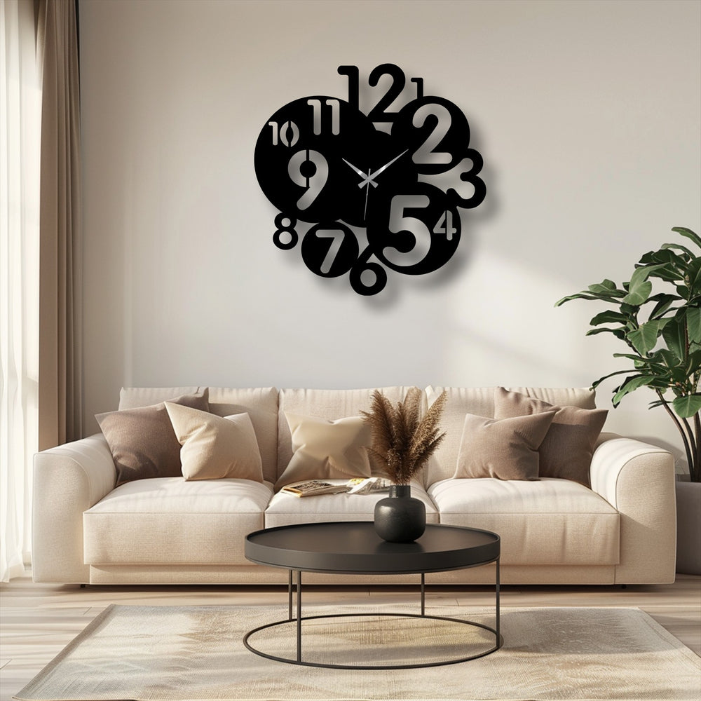 Plush cushions and a cozy rug soften a modern living room featuring a bold black abstract number metal artwork wall clock.