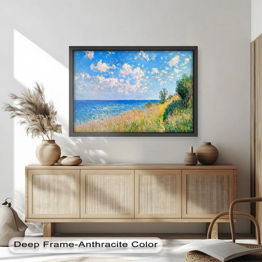 Horizontal and rectangular oil painting art piece displays an impressionist seaside landscape with vivid blues, lush greens, and dynamic skies, framed in dark anthracite.