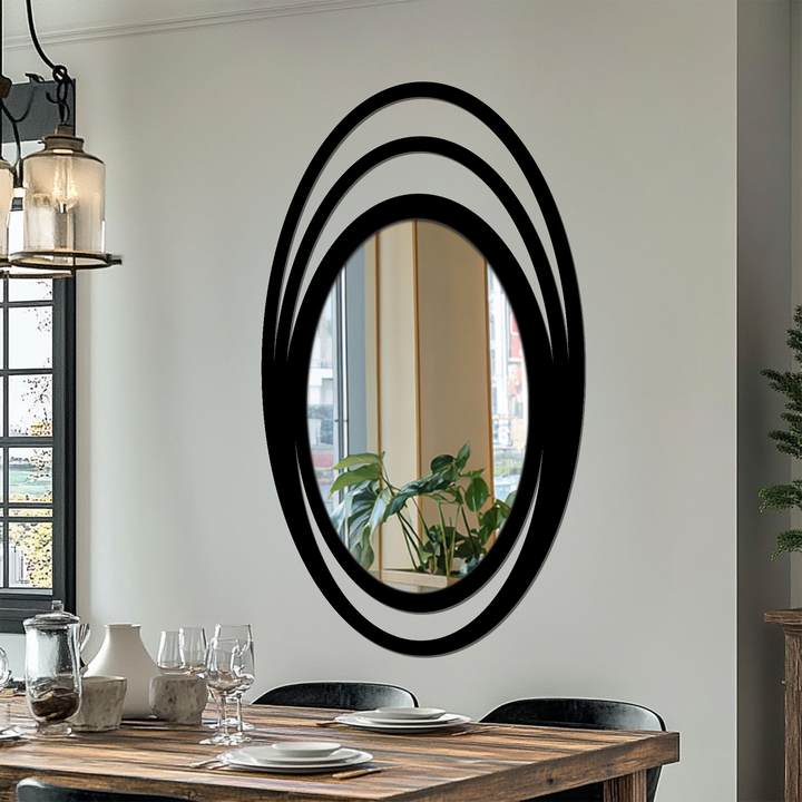 Reflecting a seamless transition between colors in the room, this triple halo oval framed wall mirror adds depth and light to modern home decor.