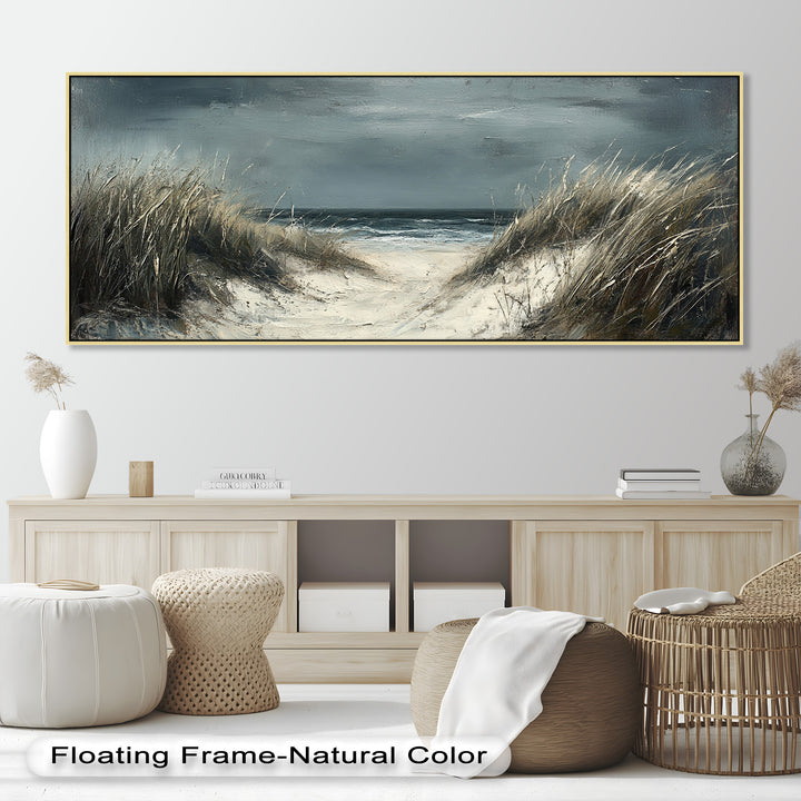 With dramatic tones of gray, beige, and deep blue, the artwork evokes solitude, reflection, and the raw beauty of an untamed shoreline.