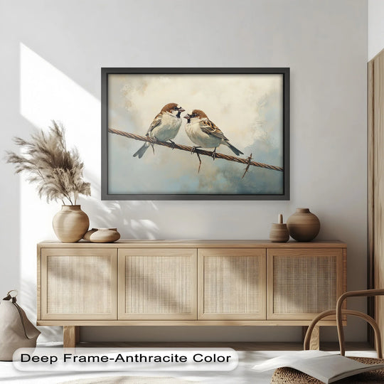 Framed in deep anthracite, this oil painting art piece showcases two sparrows on a wire with a refined, dark finish that enhances the artwork's details.