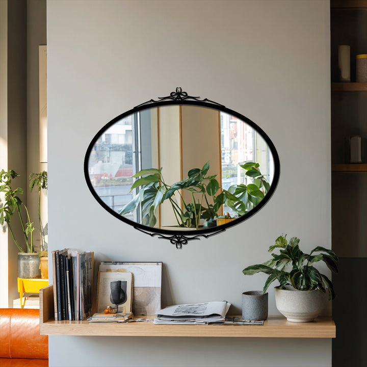 Reflecting a calm and curated space, the elegant simplicity oval floor mirror brings a tranquil mood with its subtle side accents, enhancing the room's metal wall decor.