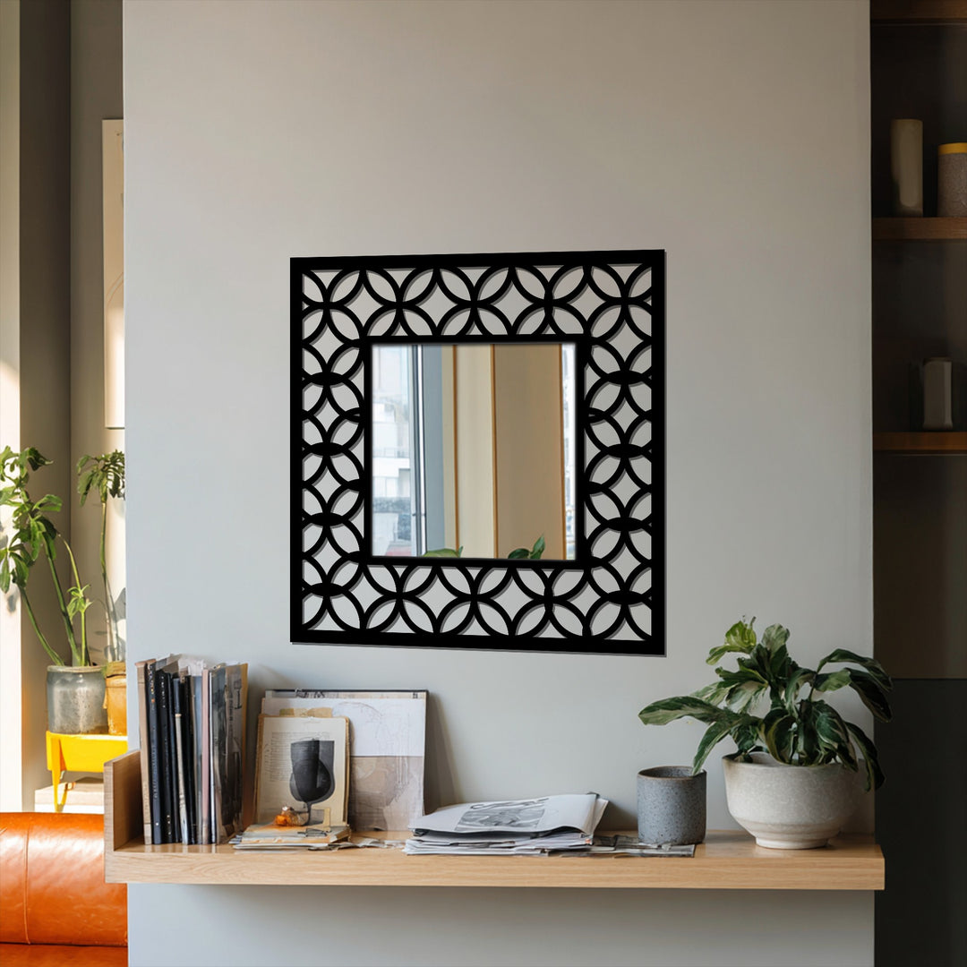 Black is the dominant color of this square framed wall mirror featuring an interlocking circle pattern, creating a modern metal art for wall display.