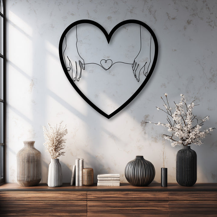 Negative space skillfully defines the connected hands and small heart within this minimalist love metal wall art, a captivating decoration wall art piece.