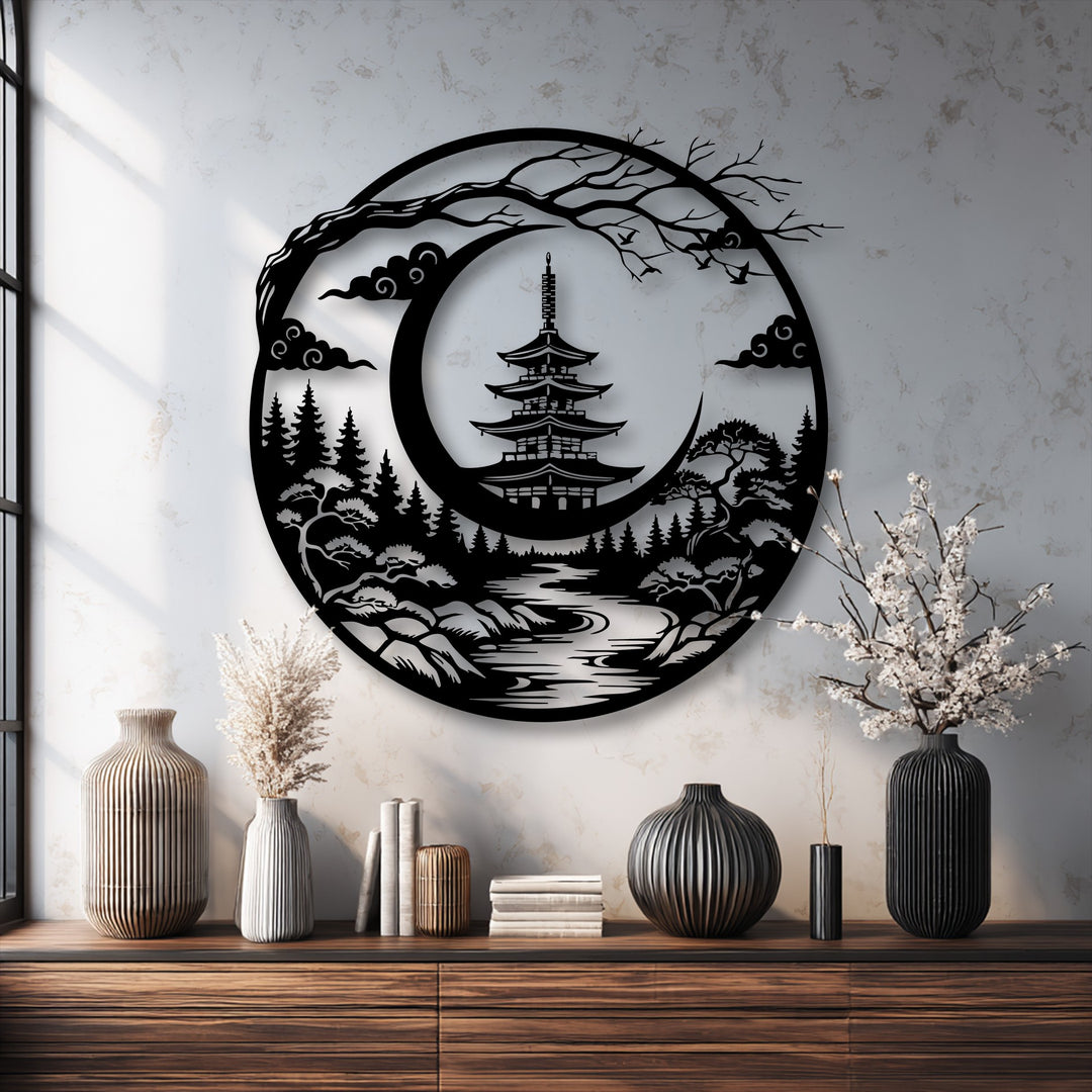 The dominant feature, a circular decorative metal art piece, strikingly depicts a Japanese pagoda and crescent moon in a zen landscape.