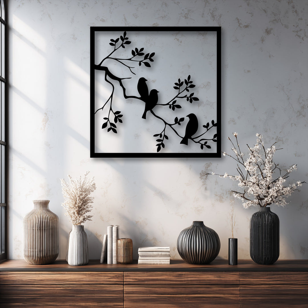 Foreground shows a wooden console table with ribbed vases, highlighting Birds on Branch Metal Wall Art, stunning metal art for wall.
