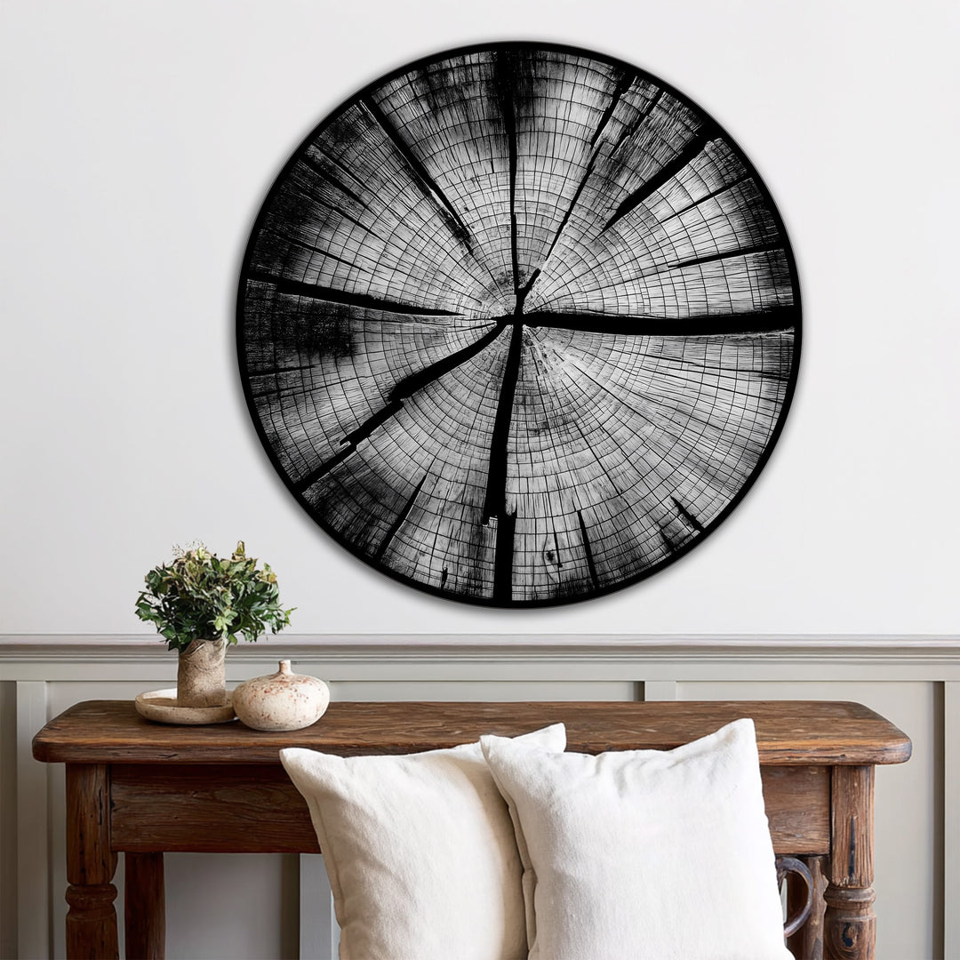 A simple white wall and wainscoting provide a stark contrast to the dark Monochrome Tree Rings oil painting art prints, adding depth to the minimalist decor.