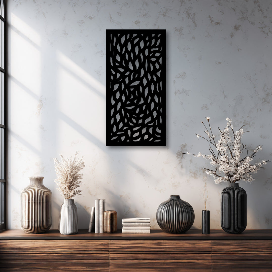 The abstract quality of the nature-inspired leaf pattern on this unique metal wall art panel creates dynamic shadows.