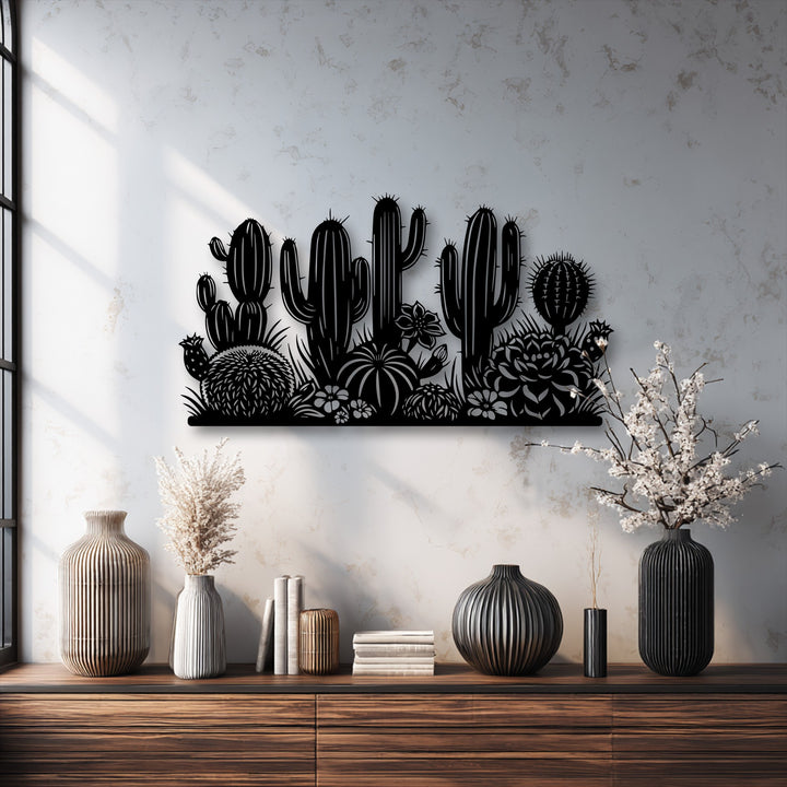 The striking color contrast highlights the stark black desert cactus garden silhouette metal artwork against the bright, textured wall.