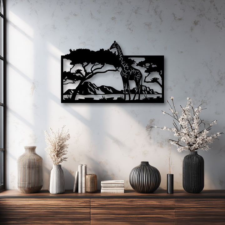 Vases, dried plants, and books on a dark wooden console table create a stylish foreground to the savannah giraffe metal artwork.