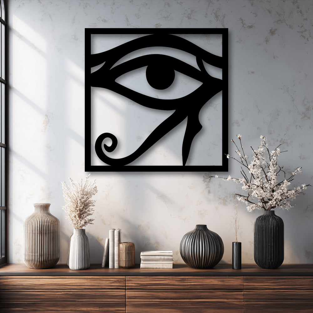 The striking negative space defines this Eye of Horus metal artwork, forming the iconic ancient Egyptian symbol with shadow play.