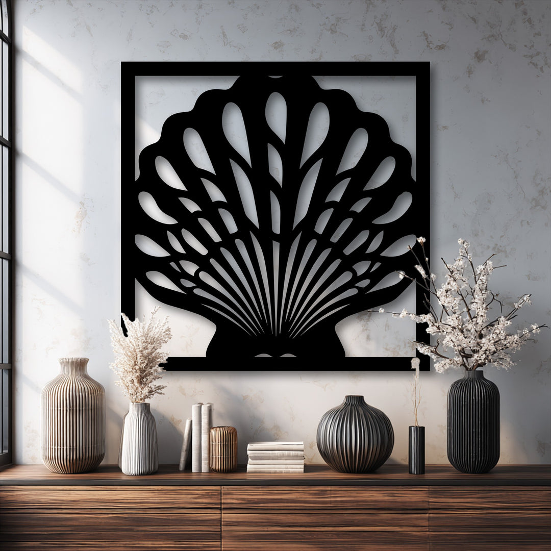 The gritty surface texture of the wall highlights the sleek unique metal wall art, elegant seashell frame, and ribbed vases.