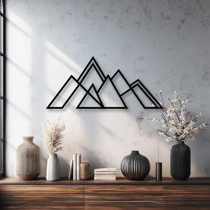 The sleek, durable metal wall decor features a minimalist geometric mountain design, offering premium material quality.