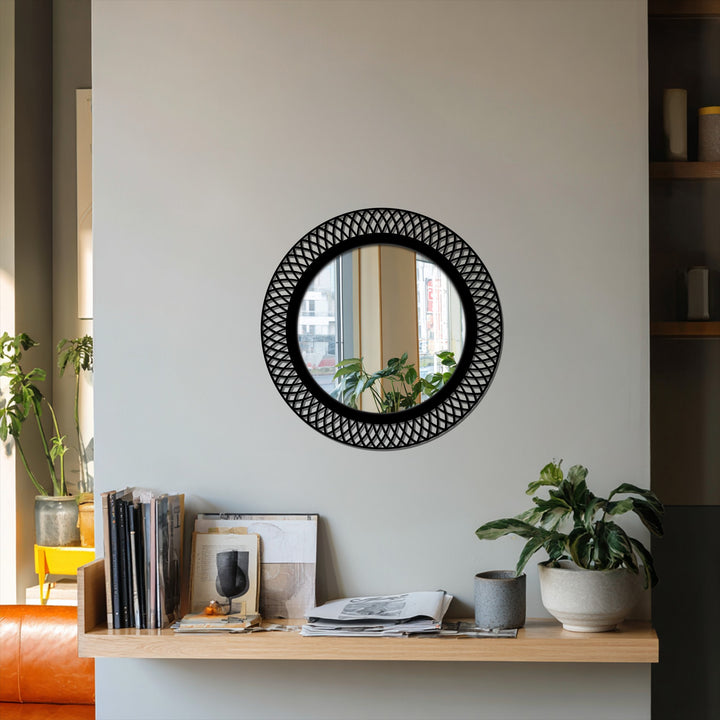 The flowing geometric design of this round stained glass wall mirror gives a sense of movement, framed by a modern black metal lattice, adding dynamic home decor.