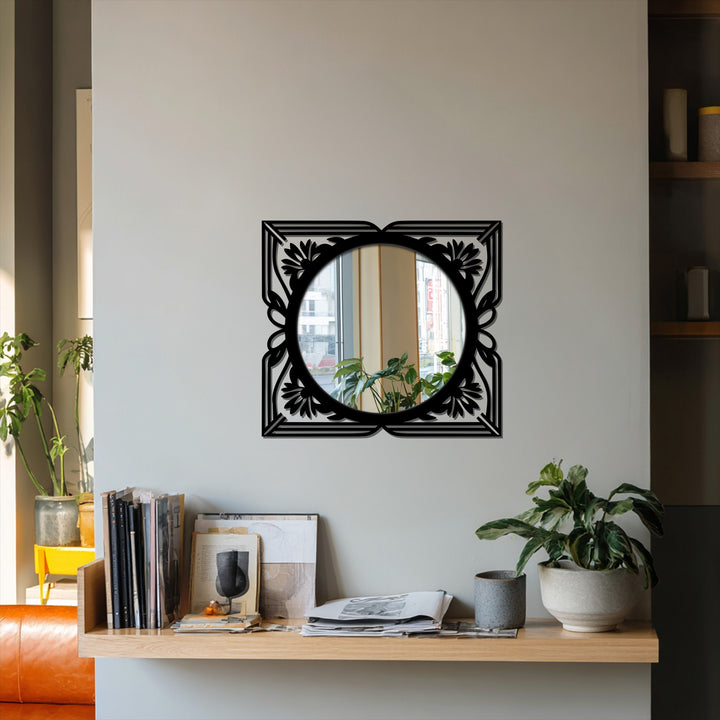 Negative space enhances this floral Art Deco mirror with an elegant black metal frame, perfect for decorating with wall mirrors and adding a statement design to any space.