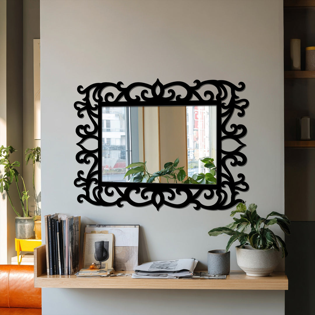 Elegant ornate floral scroll frame mirror presents sophisticated black metal wall decor as its central subject.