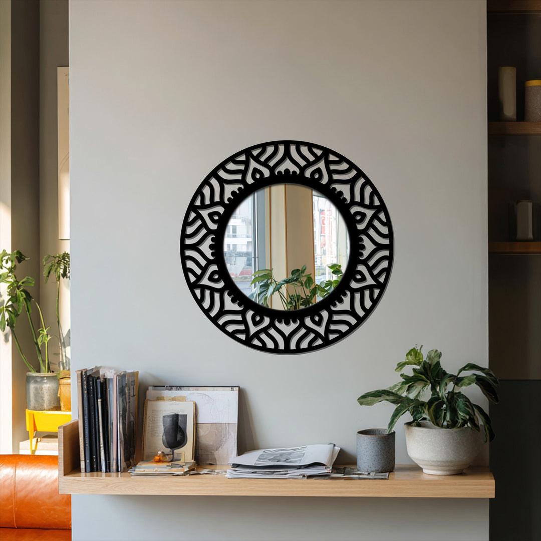 Warm tones accentuate the reflection in this abstract patterned round floor mirror featuring a black metal statement design, enhancing modern wall mirrors.