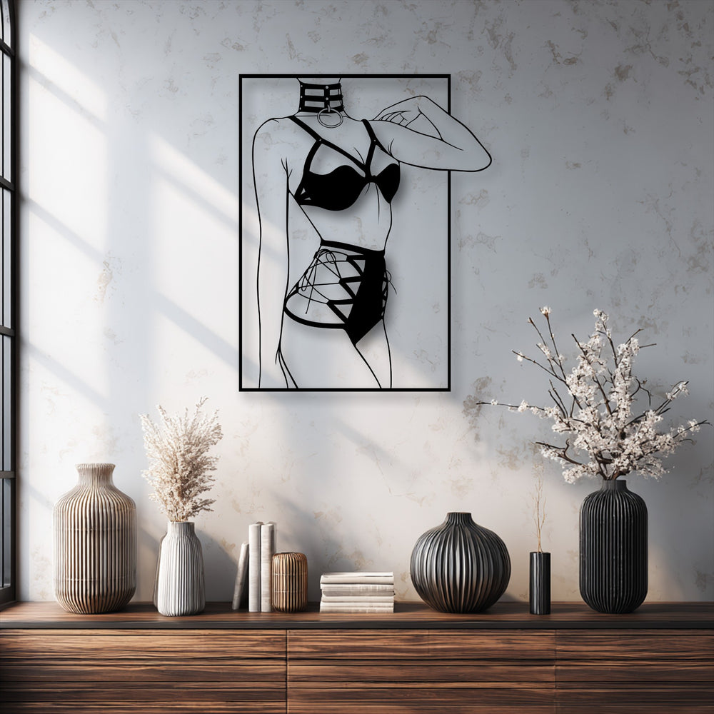 A sensual and sophisticated mood is created by the minimalist female silhouette decorative metal art, showcasing modern line art.