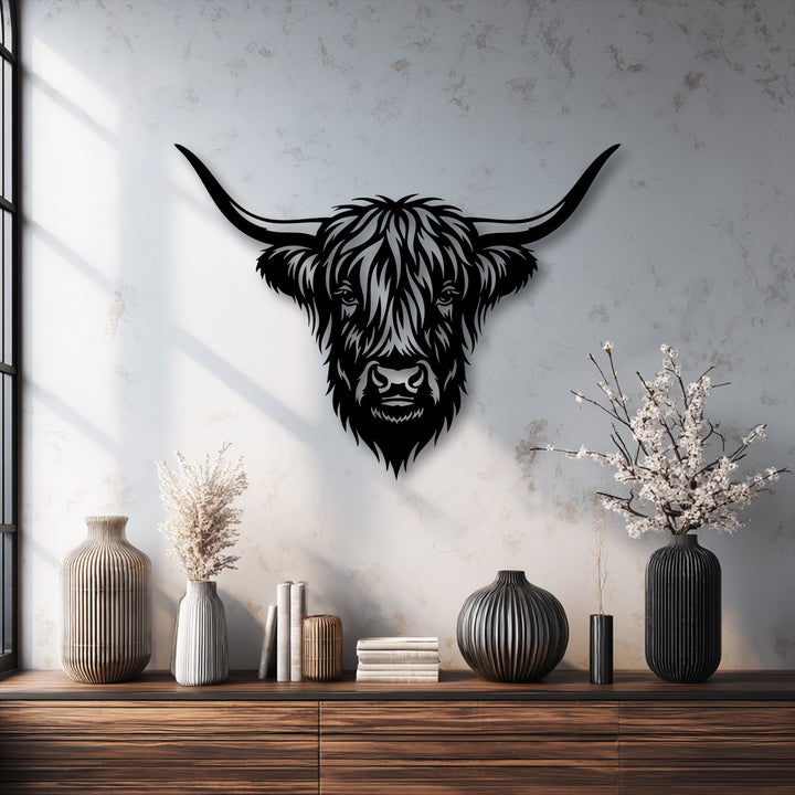 The bold, angular lines forming the Highland Bull head and its curved horns highlight the geometric nature of this unique metal wall art.