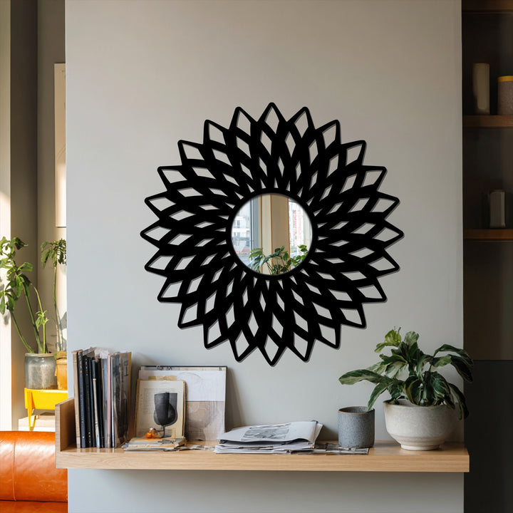 Neutral wall art highlights a geometric flower modern mirror above a wooden shelf, complementing the room's decor with its clean lines.