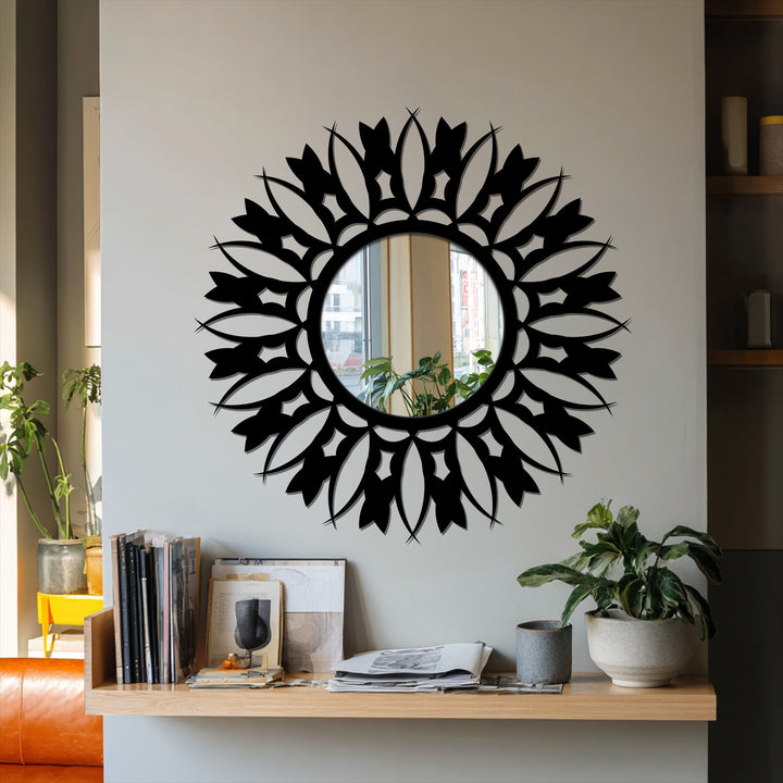 Black-framed floral sunburst stained glass wall mirror features a sophisticated matte finish, enhancing its elegant, decorative appeal.
