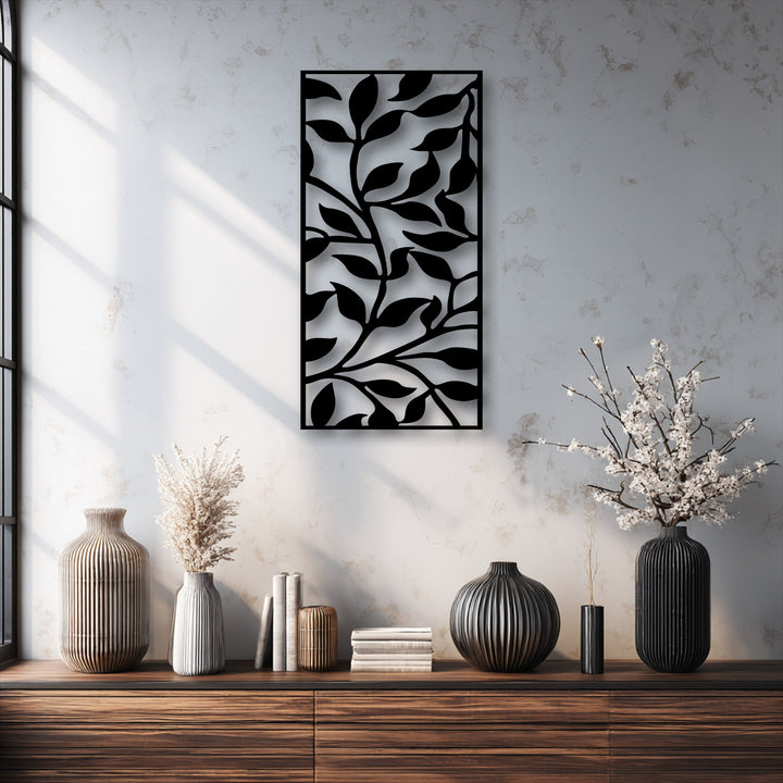 The matte black finish of the abstract leaf branch pattern metal wall decor adds a sleek, modern botanical touch to the space.