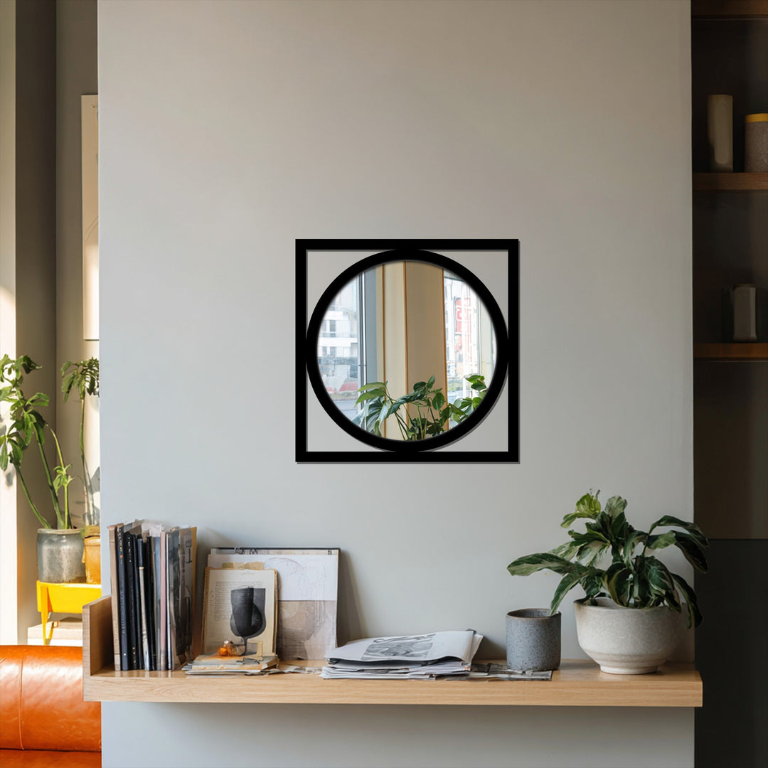 Showcasing geometric harmony, a black square frame encompasses a round modern mirror, reflecting a serene blend of shapes and minimalist design.