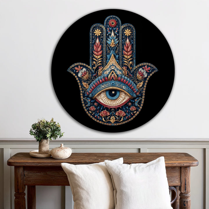 Highlighting the edge of this round oil painting wall art featuring an ornate Hamsa hand with a protective eye, the black border elegantly frames the design.