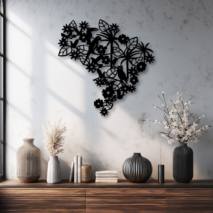 Strong window light casts deep, geometric shadows across a textured white wall, emphasizing the intricate black floral bird metal art for wall.