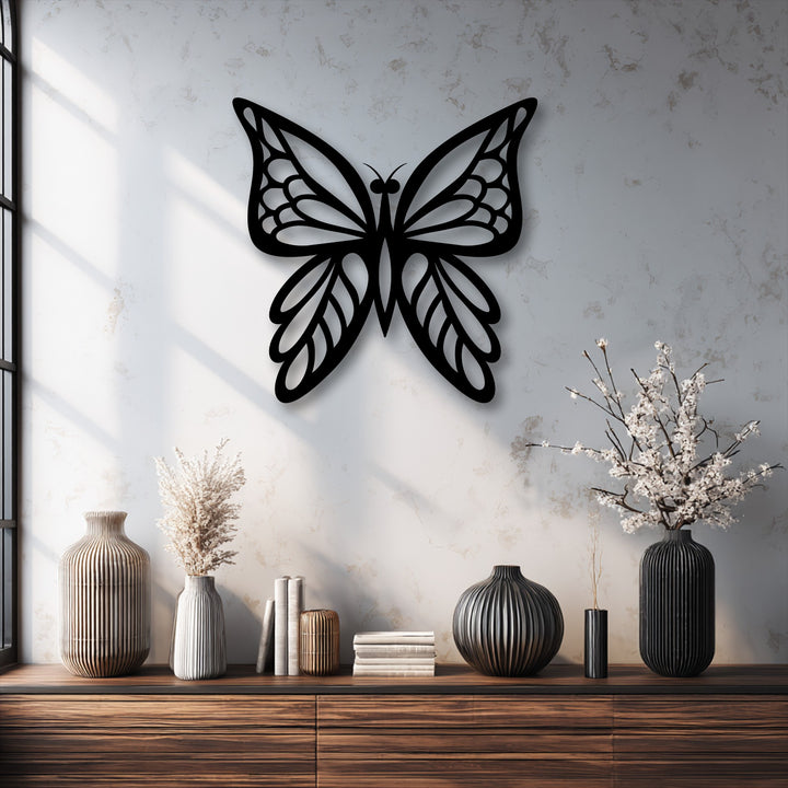 Rich color saturation emphasizing the elegant butterfly silhouette metal decoration wall art, contrasting with the soft white textured background.