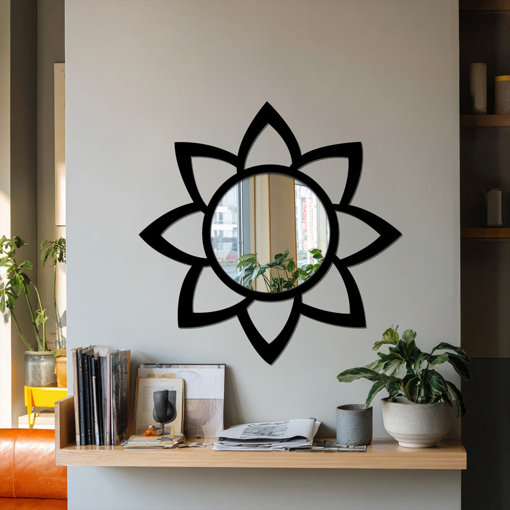 Highlighting the layering effect, the petal-shaped framed wall mirror with a black metal frame enhances light and reflection in a room.