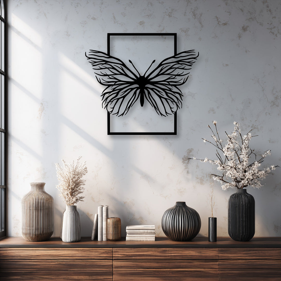 Stark color contrast highlights the black Ethereal Butterfly Frame metal art for wall against a bright textured background.