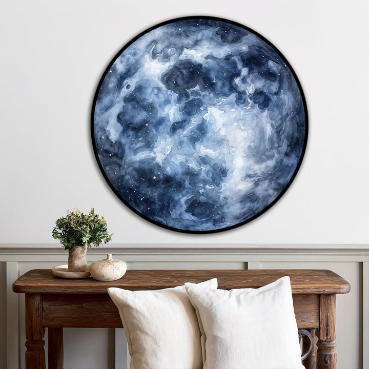 Against the neutral backdrop, the round midnight nebula oil painting wall art evokes a cosmic, celestial feel above the rustic wooden console table.