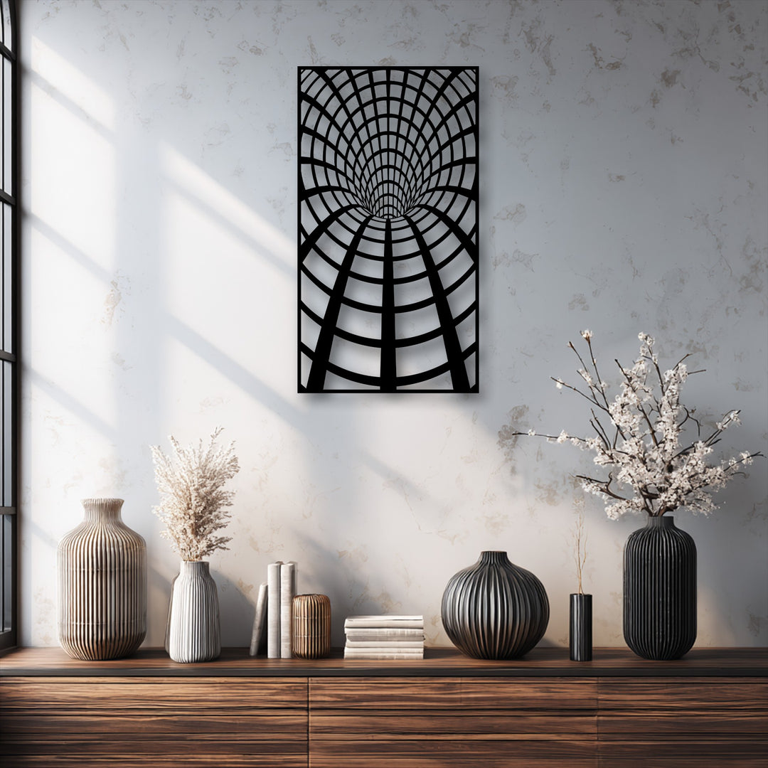 The dark wooden console table in the foreground displays ribbed vases, books, and dried plants, complementing the unique metal wall art.