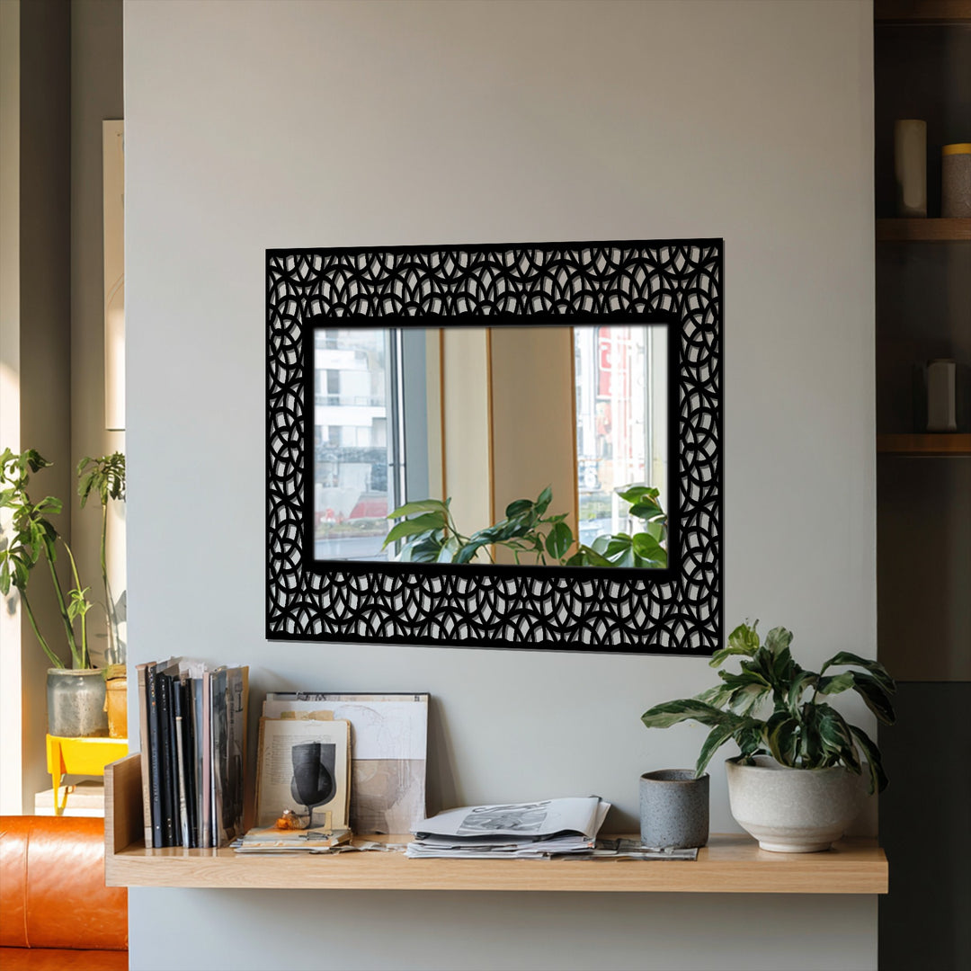 Geometric interlocking arc patterns highlight the black metal frame of this modern floor decorative mirror, creating depth and texture.