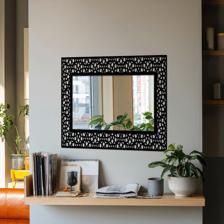 Geometric interlocking arc patterns highlight the black metal frame of this modern floor decorative mirror, creating depth and texture.