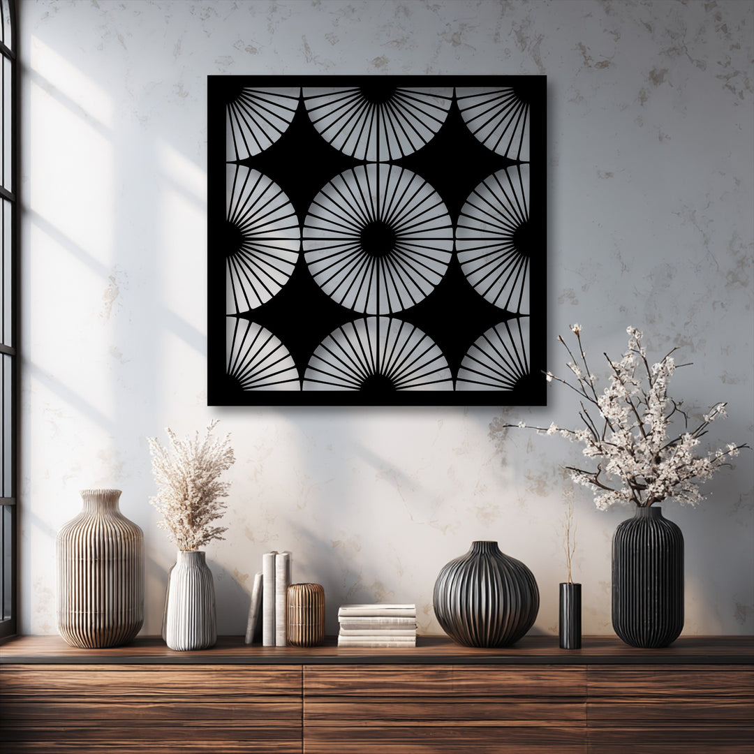 The abstract quality of this metal artwork is evident in its radiant fan pattern, forming a striking geometric symmetry.