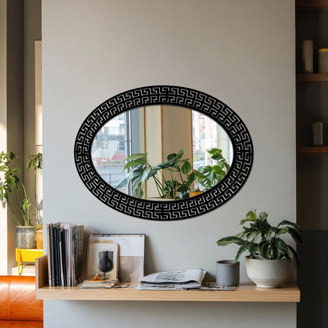 Brightest reflections fill the oval Neo Greco patterned framed wall mirror, showcasing the nearby window and plants within the looking glass.