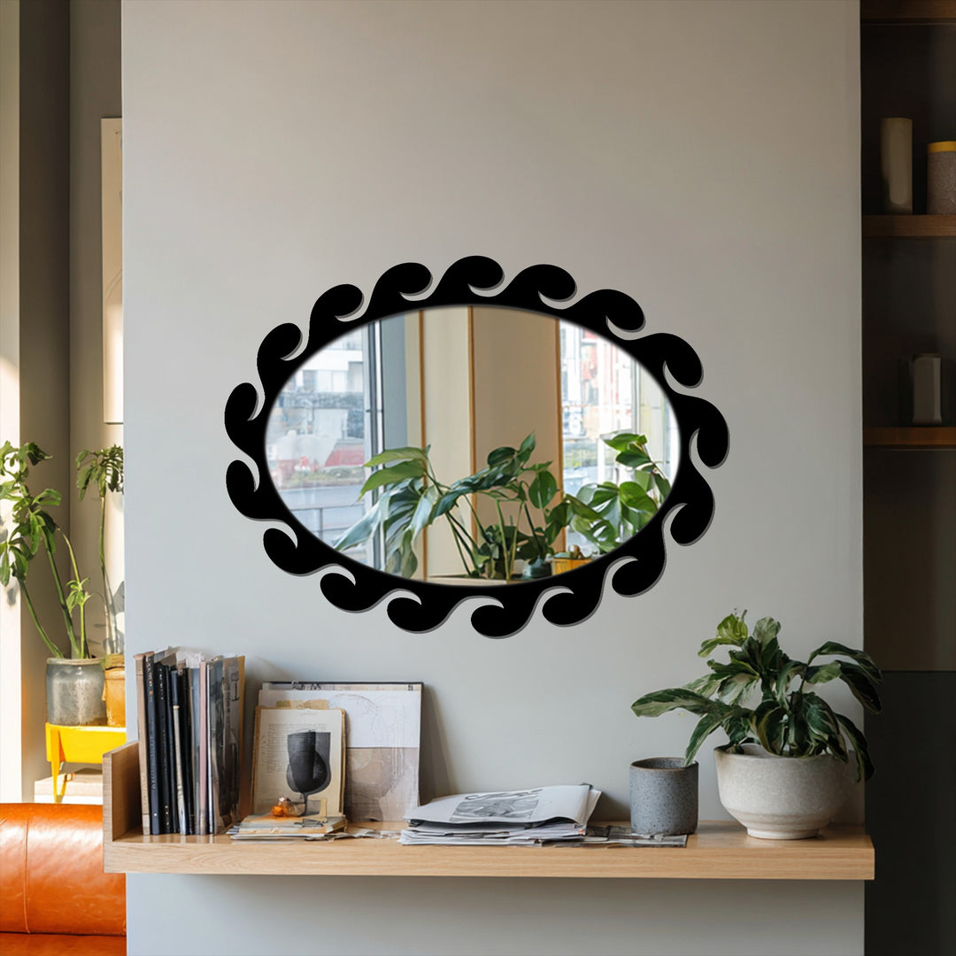 Play of light and shadow emphasizes the sculpted wave pattern of the fluid, black-framed decorative mirror, reflecting the room's subtle luminosity.