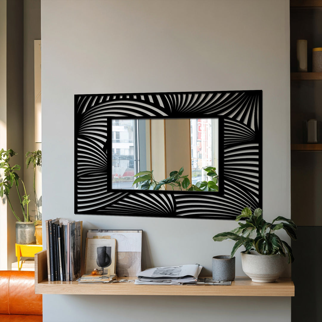 Framed by a bold, flowing pattern, this rectangular mirror uses modern, black metal to form the edge and borders, showcasing creative decorating with wall mirrors.