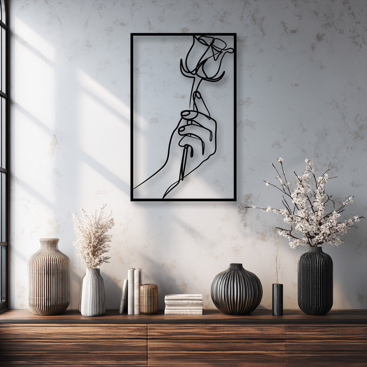 An elegant assortment of ribbed vases, dried botanicals, and books rests on a rich wooden console table, serving as stylish decoration wall art.