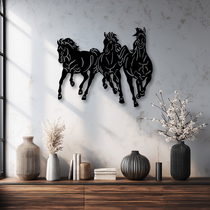 The deep matte finish of this unique metal wall art expertly portrays a dynamic trio of running horses in motion.
