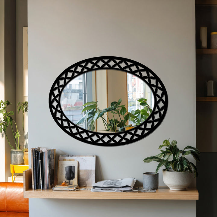 Inviting and serene, this decorative mirror features an ornate black frame, adding a touch of modern elegance to the room's ambiance.
