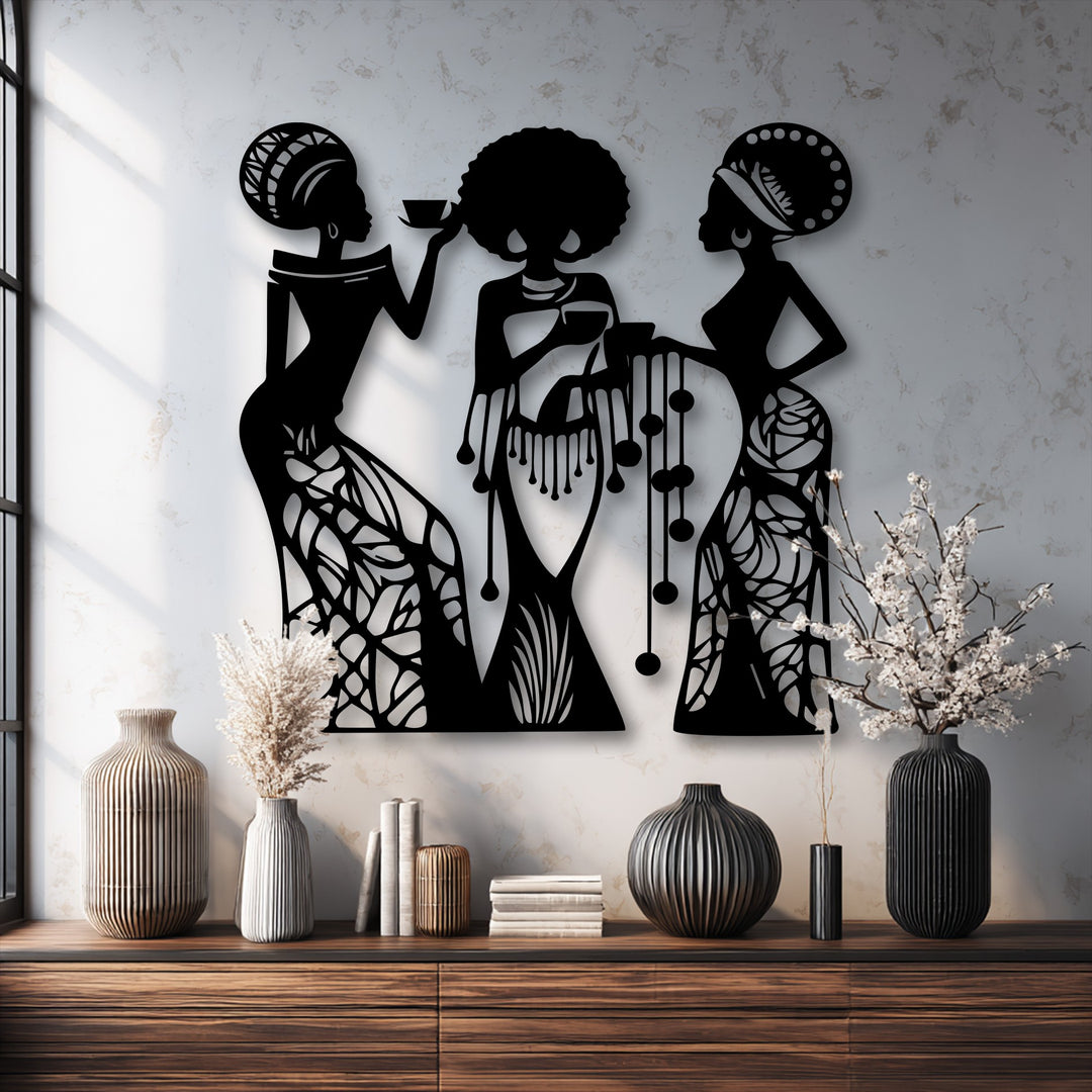 The graceful movement of three women silhouettes, captured in intricate decorative metal art, evokes a dynamic, flowing narrative.
