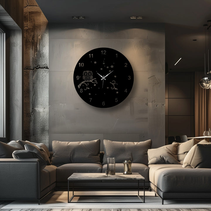 The smooth surface of the Owl Night Metal Wall Clock contrasts with the rough concrete wall, making a striking piece of metal art for wall.