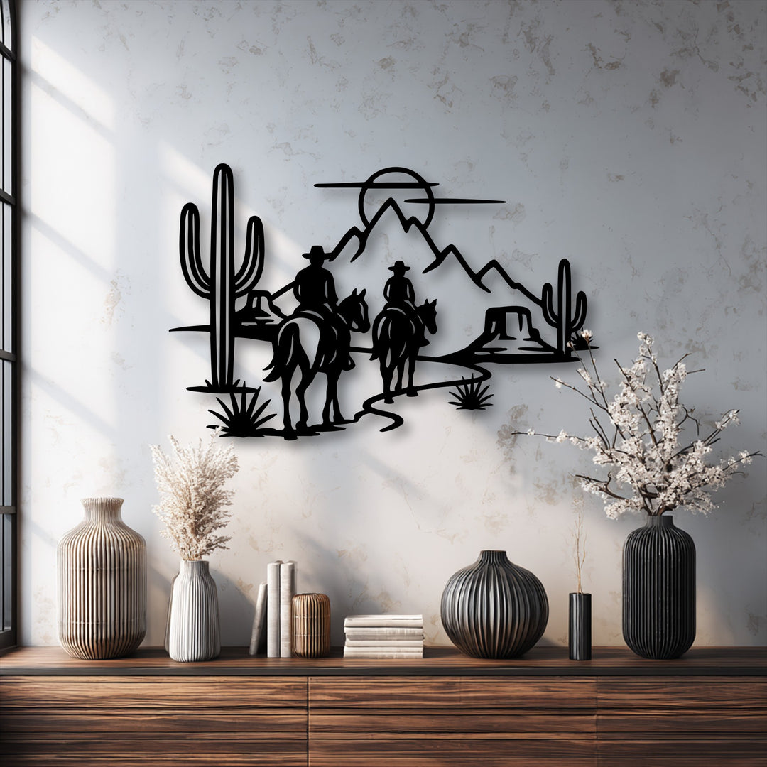 Western metal artwork showing two cowboys riding horses, their journey through the desert scene creating a powerful sense of motion.