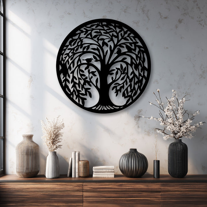The focal point is a detailed Tree of Life circular metal decoration wall art, featuring birds and intricate foliage against a textured wall.