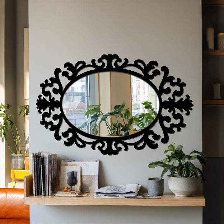 Negative space amplifies the baroque flourishes around this oval decorative mirror, creating a dynamic piece of decoration wall art.