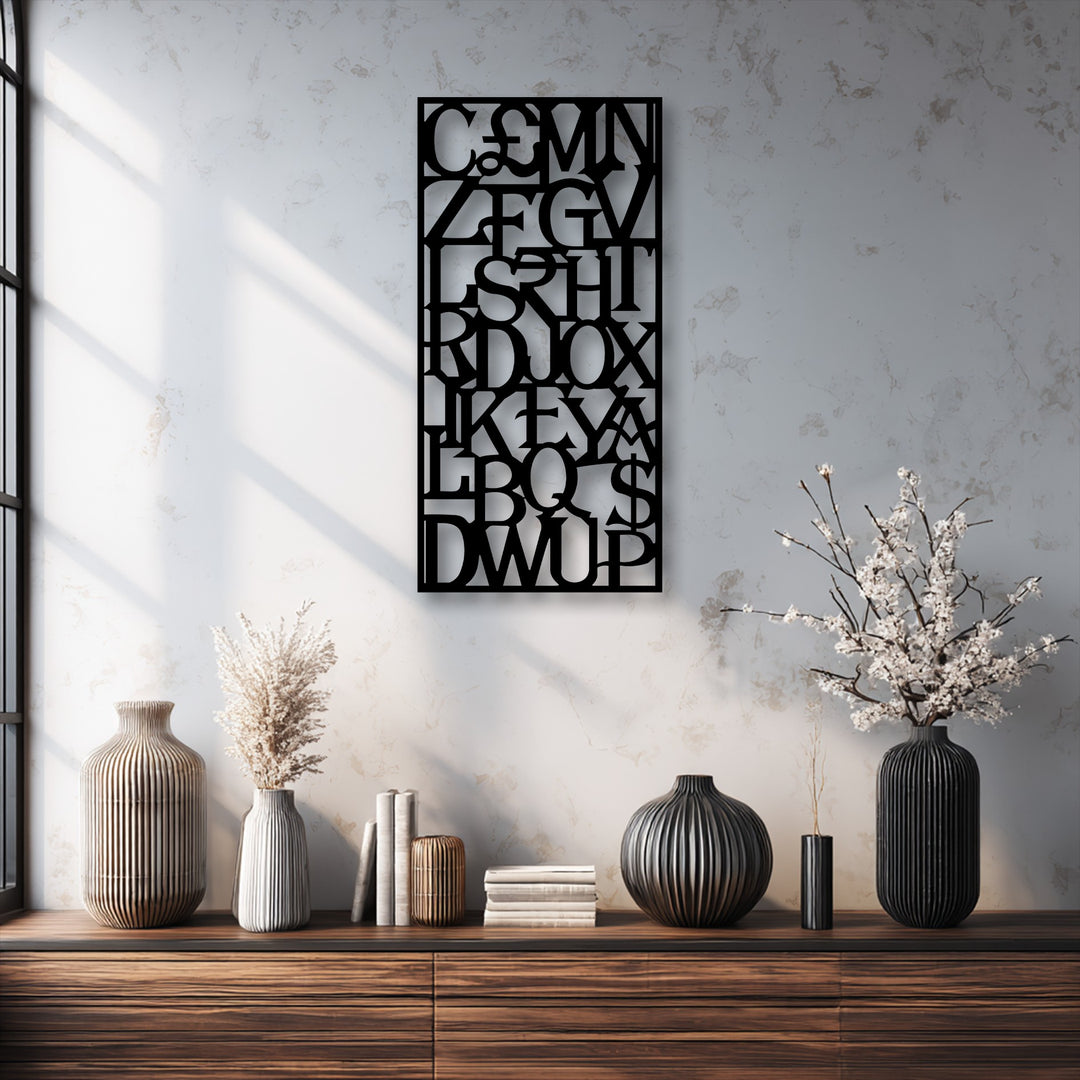 The matte black finish of the intricate laser-cut abstract alphabet grid metal wall decor creates a striking modern typography statement.